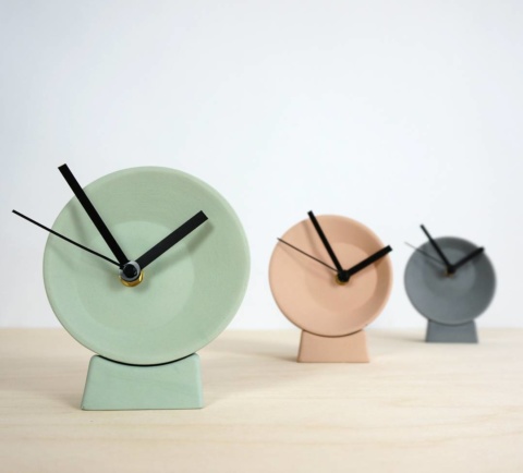 Off-center clock, in pastel colors: green, pink or grey