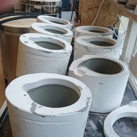 Molds of the Natural Balance lined up for casting