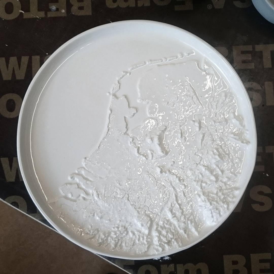 One of our new ideas, a height map of the Netherlands in a porcelain plate