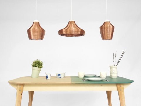 The full set of copper pendant lamps, above our table